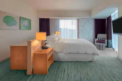 a hotel room with a bed and a television at Sheraton San Jose Hotel, Costa Rica in San José