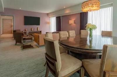 a dining room with a table and chairs at Sheraton San Jose Hotel, Costa Rica in San José
