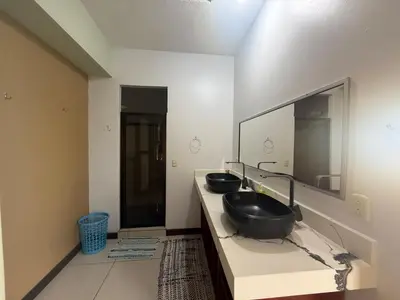 a bathroom with two sinks and a large mirror at Casa Susan in San Pedrillo