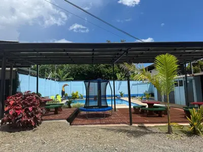 a pavilion with picnic tables and a playground at Apartamento de una habitación in San Isidro