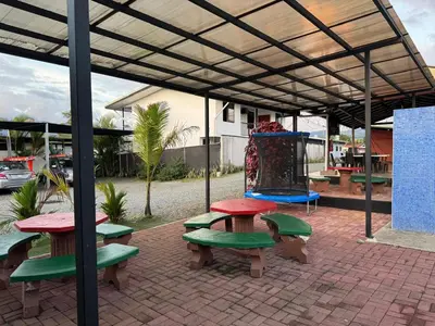 a picnic table and benches under a pavilion at Apartamento de una habitación in San Isidro