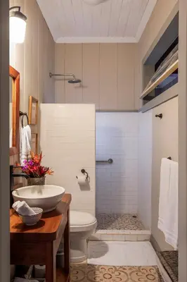 a bathroom with a sink and a toilet at Casa Hacienda La Esperanza in Turrialba