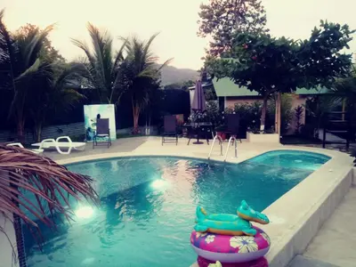 a swimming pool with an inflatablelatable at Jaco Surf Beachbungalow in Jacó