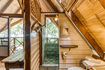 a staircase in a tiny house at El Ballenato de Bahia in Uvita