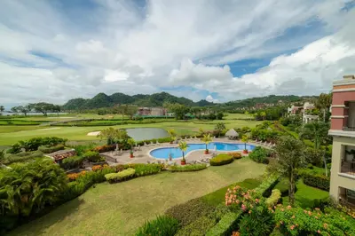 an aerial view of a resort with a swimming pool at Del Mar 3C 3 bdr Ocean View in Los Suenos in Herradura