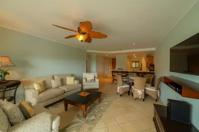 a living room with a couch and a table at Del Mar 3C 3 bdr Ocean View in Los Suenos in Herradura