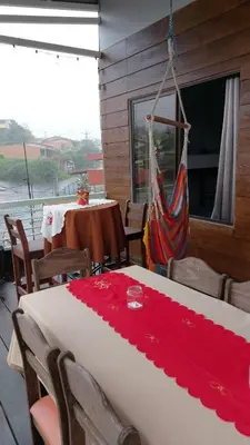 a dining room with a table with a red table cloth at Hotel Pacuare Turrialba in Turrialba