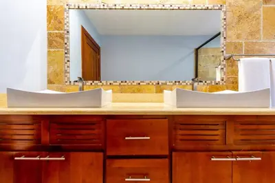 a bathroom with two sinks and a large mirror at 2 Bedroom Ocean-View Condo with Pool in Playa Flamingo
