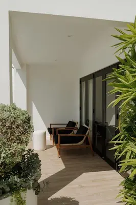 a living room with two chairs and a table at Sky House Santa Teresa - Adults only in Santa Teresa Beach
