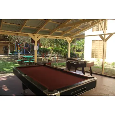 a pool table sitting under a pavilion at Centro Vacacional Bancosta in Jacó