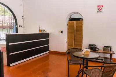 a room with a table and chairs and a counter at Hotel Casona del Valle in Potrerillos