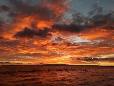 a sunset over the ocean with a cloudy sky at Casa Victoria in Puntarenas