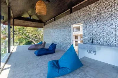 a bathroom with blue pillows and a bath tub at Stunning Home with Brand-New Guesthouse and Oceanview Terrace with Private Swimming Pool & Hot Tub in Playa Flamingo