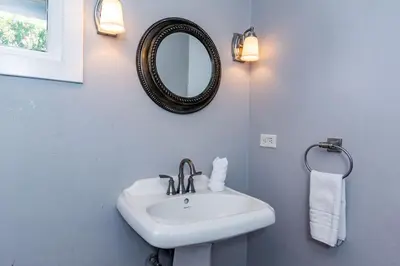 a bathroom with a white sink and a mirror at Stunning Home with Brand-New Guesthouse and Oceanview Terrace with Private Swimming Pool & Hot Tub in Playa Flamingo