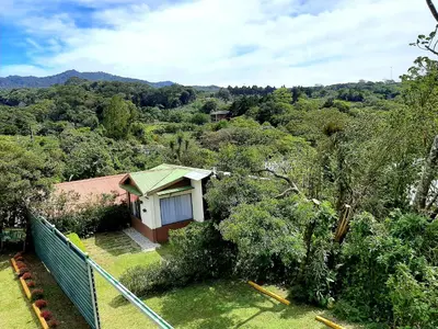 a small house in the middle of a forest at Monteverde Cecropia Paradise in Monteverde Costa Rica