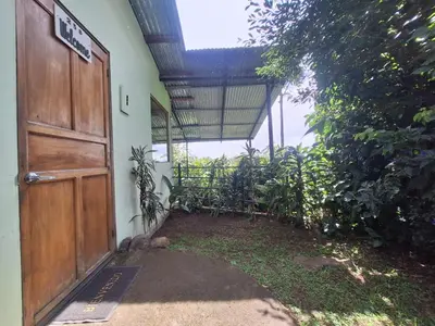 an entrance to a building with a wooden door at Monteverde Cecropia Paradise in Monteverde Costa Rica