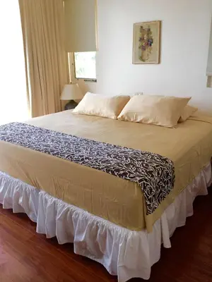 a large bed in a room with at Montelaguna Boutique Hotel in Sámara