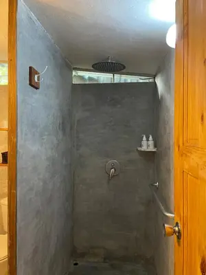 a shower in a bathroom with a shower at Beach Villa S in Santa Teresa Beach