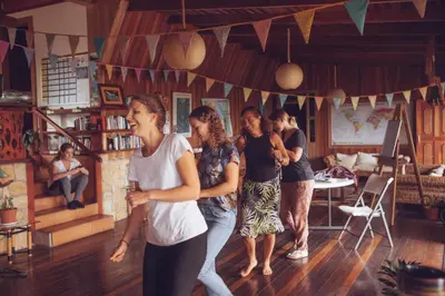 a group of people dancing in a room at Spanish by the River - Turrialba in Turrialba