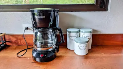 a blender sitting on top of a wooden table at Olingo Monteverde - Stunning Home Near Adventure Parks in Monteverde Costa Rica