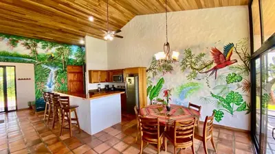 a kitchen and dining room with a table and chairs at Serenity House Panoramic Views And Swimming Pool, in El Castillo de la Fortuna