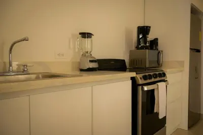 a kitchen with a sink and a blender on a counter at Casa Coco de Mer 1 in Tamarindo