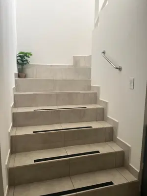 a set of stairs with a potted plant on them at Casa Coco de Mer 1 in Tamarindo