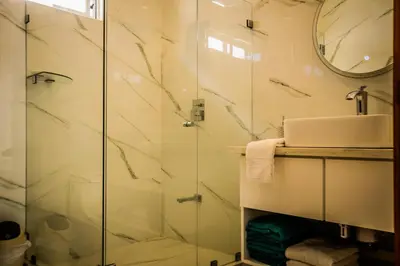 a bathroom with a shower and a sink at Casa Coco de Mer 2 in Tamarindo