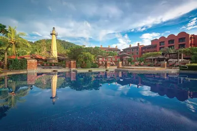 a pool with a tower in the middle of a resort at Marriott Vacation Club at Los Sueños in Jacó