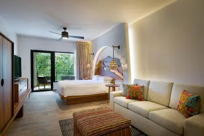 a living room with a bed and a couch at Marriott Vacation Club at Los Sueños in Jacó