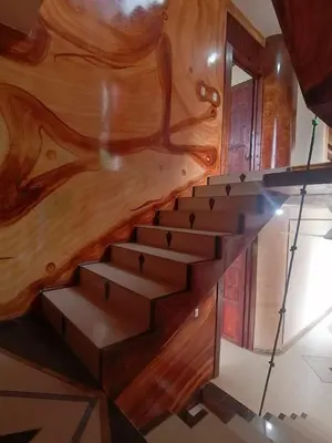 a staircase in a house with a wooden wall at El Castillo Monte Campana in Puntarenas
