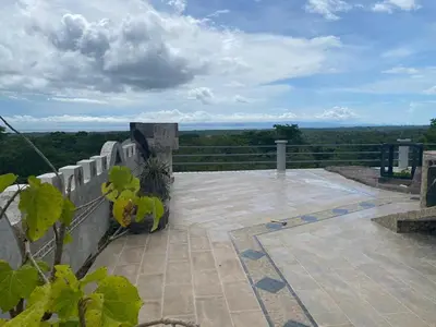 a balcony with a view of the ocean at El Castillo Monte Campana in Puntarenas