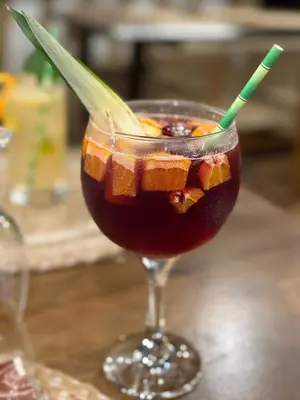 a drink with a straw in a glass on a table at Layan Hotel & Spa in Manuel Antonio