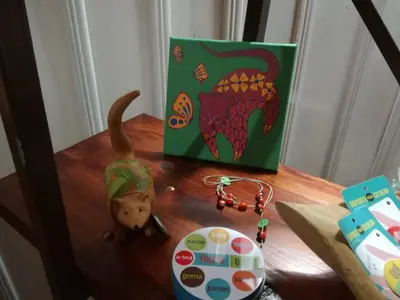 a table with a bag and a stuffed animal on it at Casona Rústica & Bungalow in Fortuna