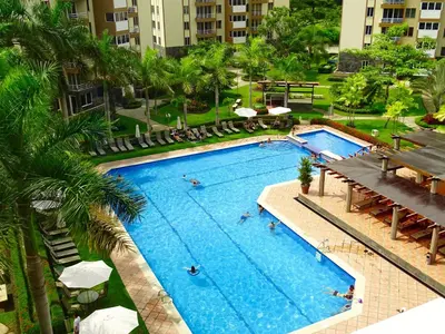 an overhead view of a swimming pool in a hotel at 3Room Jaco Condos in Jacó