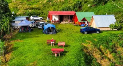 an aerial view of a camping area with tents and cars at Sunset Inn Arenal B&B in Fortuna