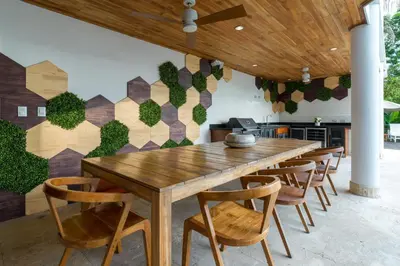 a dining room with a wooden table and chairs at Casa Anjali by Sandglass in Manuel Antonio