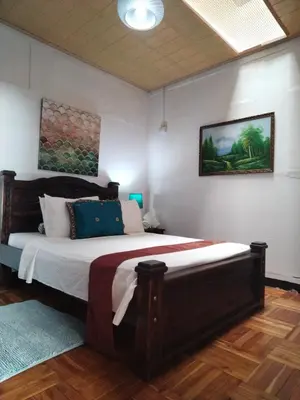 a bedroom with a large bed in a room at Lajuela BnB & Hostel in Alajuela City