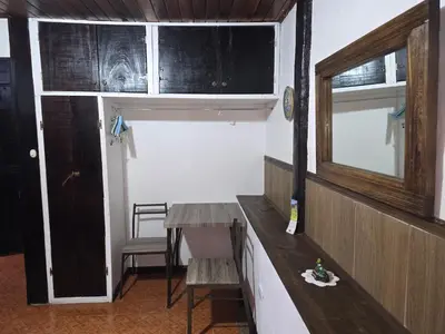 a room with a table and a window and a door at Casa Irazú in Cartago