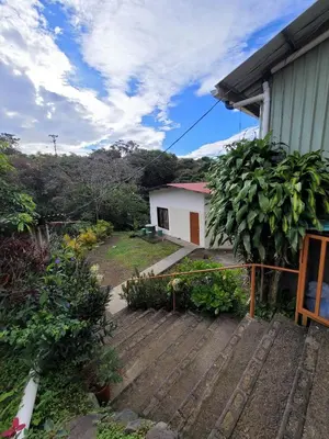 a view of a house with a wooden deck at Cabinas Selva Verde in Monteverde Costa Rica
