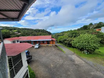 an aerial view of a house with a car parked in the driveway at Cabinas Selva Verde in Monteverde Costa Rica