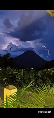 a lightning bolt in the sky over a mountain at Essence Arenal Spa & Yoga in El Castillo de La Fortuna