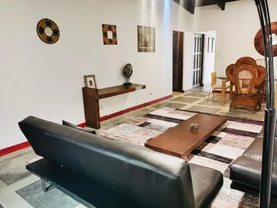 a living room with a couch and a table at Colours Oasis Resort ADULT ONLY in San José