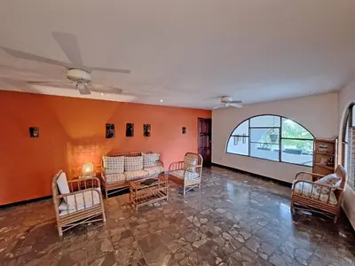 a living room with chairs and a large window at Colours Oasis Resort ADULT ONLY in San José