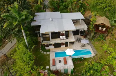 an aerial view of a house with a swimming pool at Villas by Tekoa in Uvita