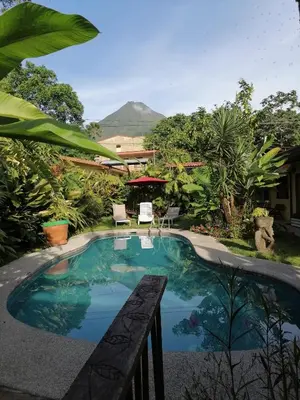 a swimming pool with a view of a mountain at Hotel Arte Natura in Fortuna