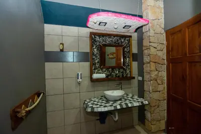 a bathroom with a sink and a mirror at Hotel Arte Natura in Fortuna