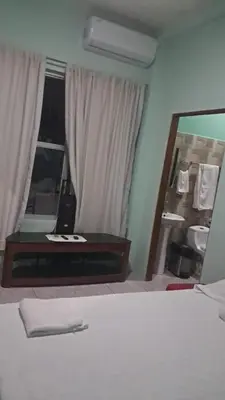 a bedroom with a large mirror and a bed at apartamento 3 in Fortuna