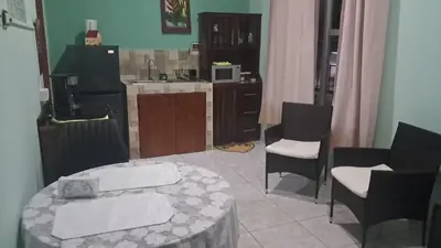 a living room with a table and chairs and a kitchen at apartamento 3 in Fortuna