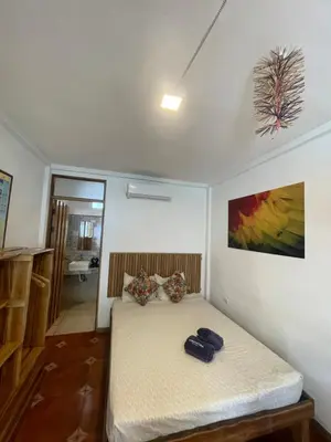 a bedroom with a bed in a room at Hotel Pura Natura Beachfront Tortuguero in Tortuguero